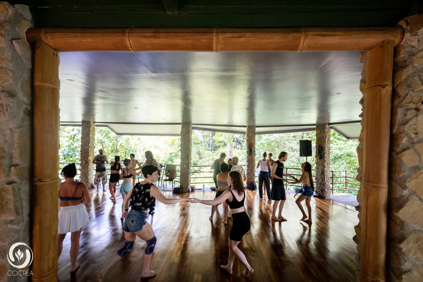 Open-air yoga deck among rainforest trees at Posada Natura