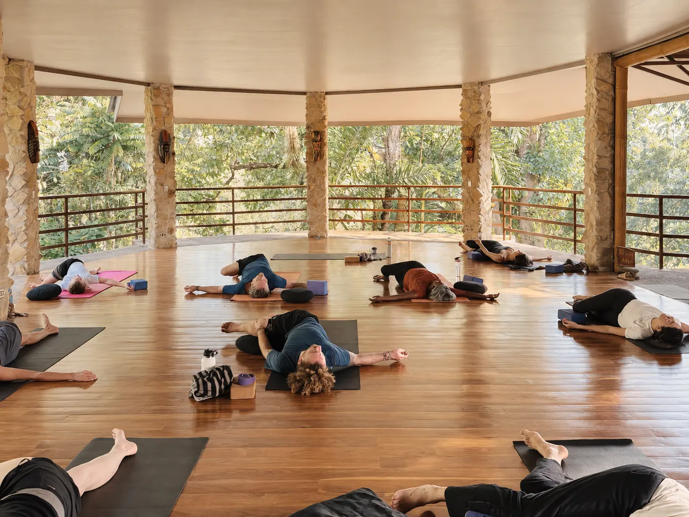 Guests resting in the open-wall yoga shala